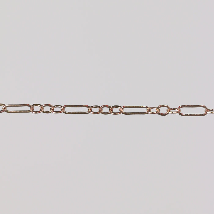 Solid gold paperclip cable chain on a gray background