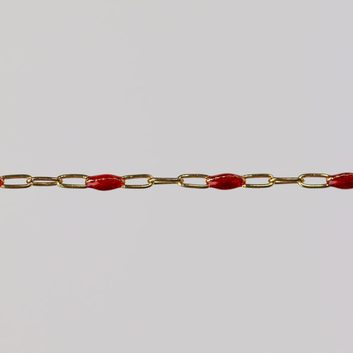 Gold chain with red enamel beaded blobs on it