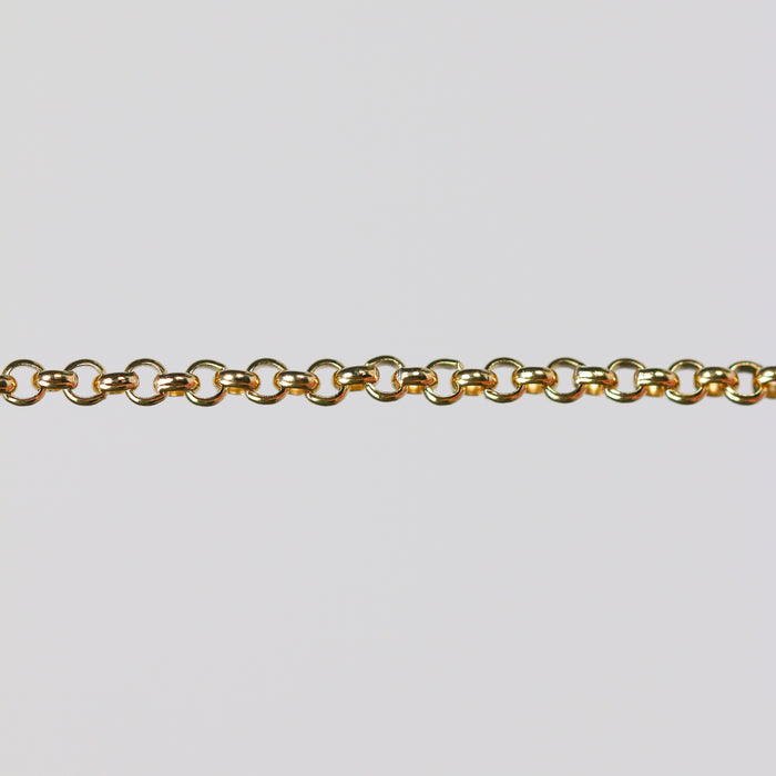 Round rolo chain for permanent jewelry over a gray background