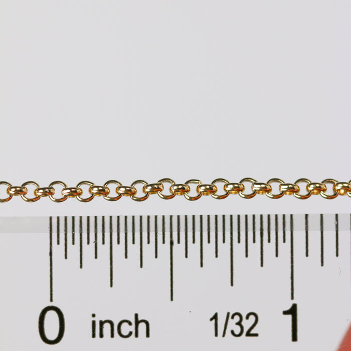 Gold rolo chain next to a ruler to show the size of each loop on the chain.