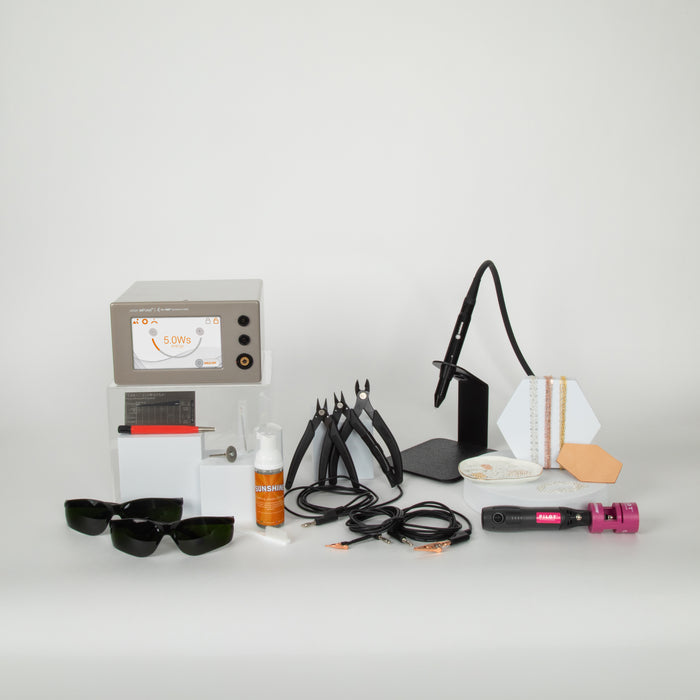 Collection of permanent jewelry equipment, supplies, and tools on a white background