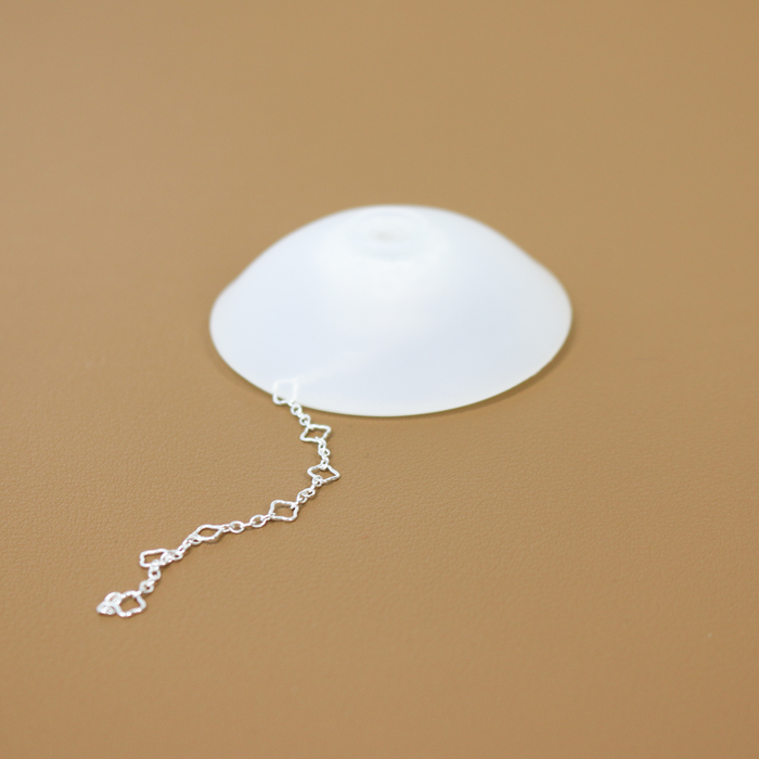 Closed protective portable case for holding permanent jewelry chains while still being able to use the chains.