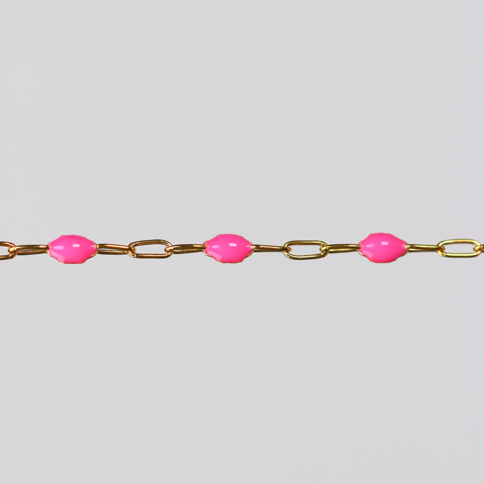 Gold chain with rose enamel on a light gray background