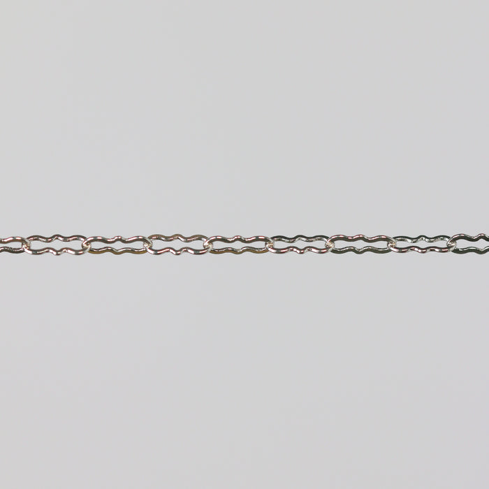 Silver chain on a light gray background