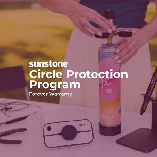 Person holding a sunstone product with text about the 'Circle Protection Program' on a blurred background.