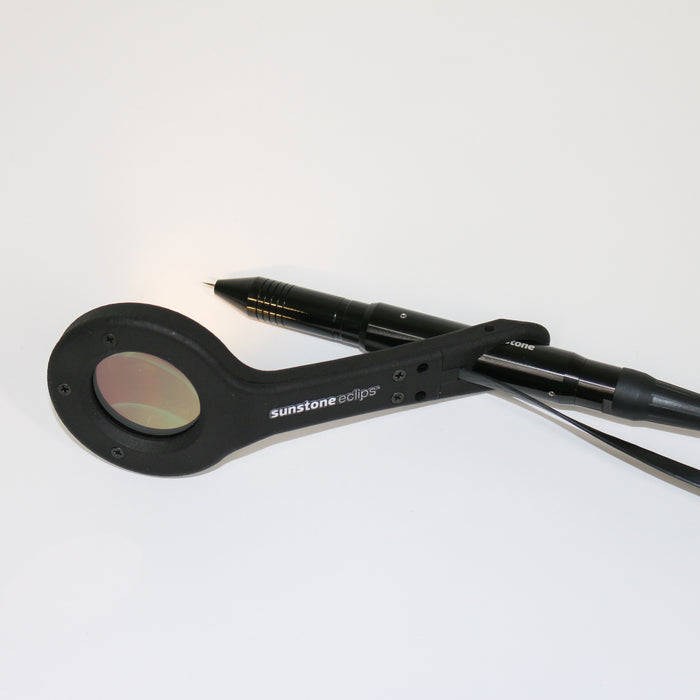 A small magnifying glass with an auto darkening lens that fits on a permanent jewelry stylus.