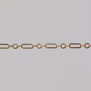 Gold chain on a gray background