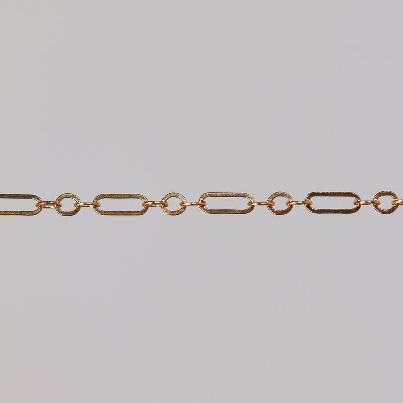 Gold chain on a gray background