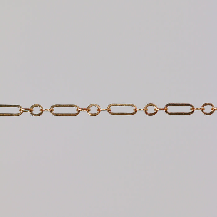 Gold chain on a gray background