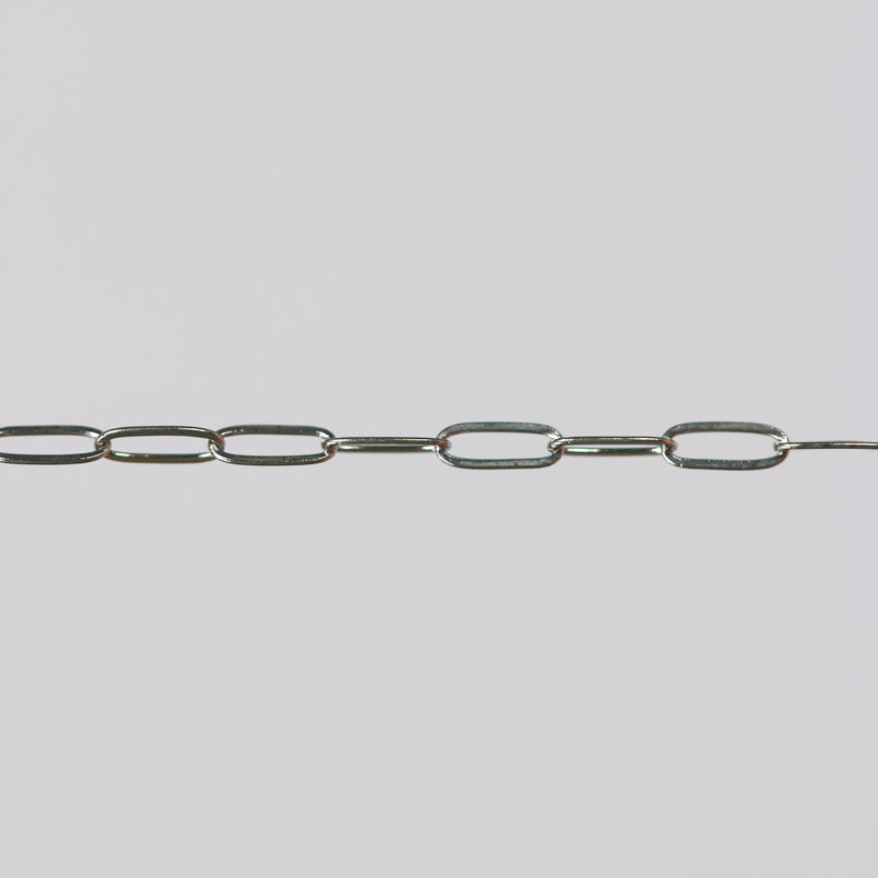 White gold oval paperclip chain on a light gray background