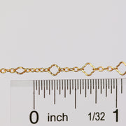 Alissa clover chain next to a ruler showing the size of the chain.
