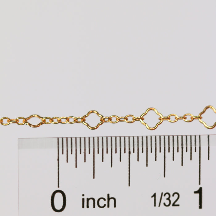 Alissa clover chain next to a ruler showing the size of the chain.
