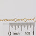 Alissa clover chain next to a ruler showing the size of the chain.