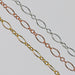 Three chains in gold, rose gold, and silver on a gray background