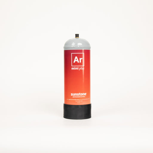 A small tank of compressed argon gas for welding permanent jewelry