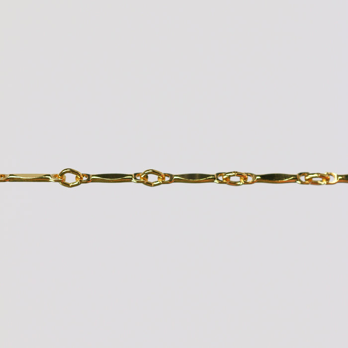 Dapped bar and link brittany chain in (GFY) on a light gray background