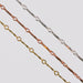 Three dapped bar and link chains for permanent jewelry on a light gray background