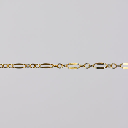 Gold dapped link chain for PJ on a light gray background