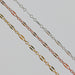 Three chains on a light gray background. The chains are Silver, Rose Gold, and Yellow Gold and have a long dapped link between three short links.
