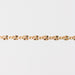 Gold chain bracelet closeup on a light gray background