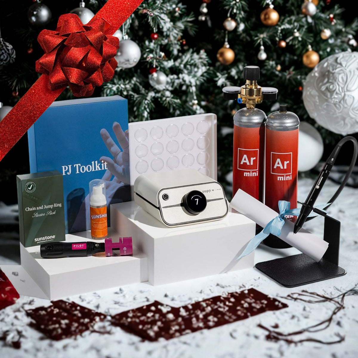 Photo of the Zapp Plus 2 Dream Starter Kit from Sunstone underneath a christmas tree with a bow on it.