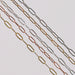 Flat elongated oval chains laid out side by side in different metal types. 14 karat gold, 14/20 gold filled, and sterling silver options are depicted.