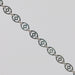 Silver chain with disks linked together. The disks have holes in them that give the chain a light, airy look.