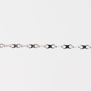 Silver chain with an infinity design on a white background