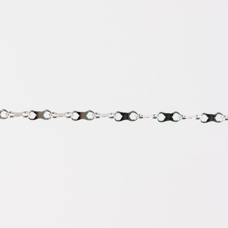 Silver chain with an infinity design on a white background