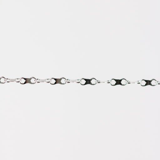 Silver chain with an infinity design on a white background