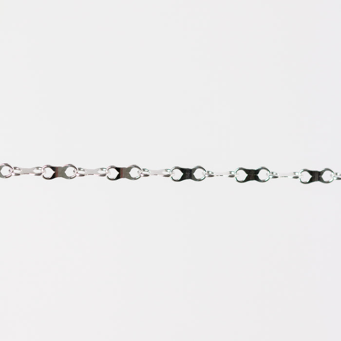 Silver chain with an infinity design on a white background