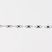 Silver chain with an infinity design on a white background