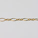 Gold oval chain on a light gray background