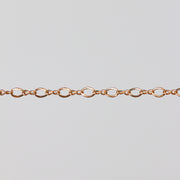 Yellow gold chain with twisted links to look like infinity symbols.
