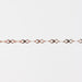Rose gold infinity chain bracelet on a light gray background