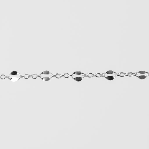 Silver bracelet with hammered links on a light gray background