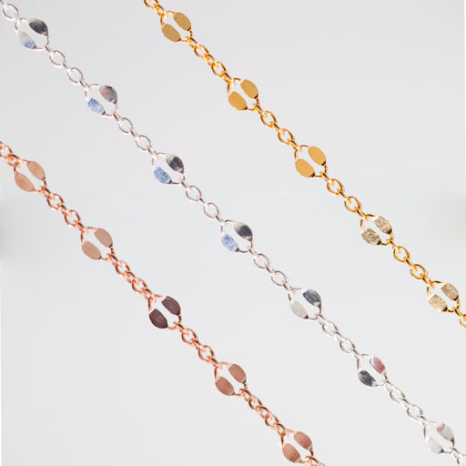 Three delicate chain bracelets in yellow gold, silver, and rose gold, each featuring a row of alternating small round and large hammered links, displayed against a clean white background.