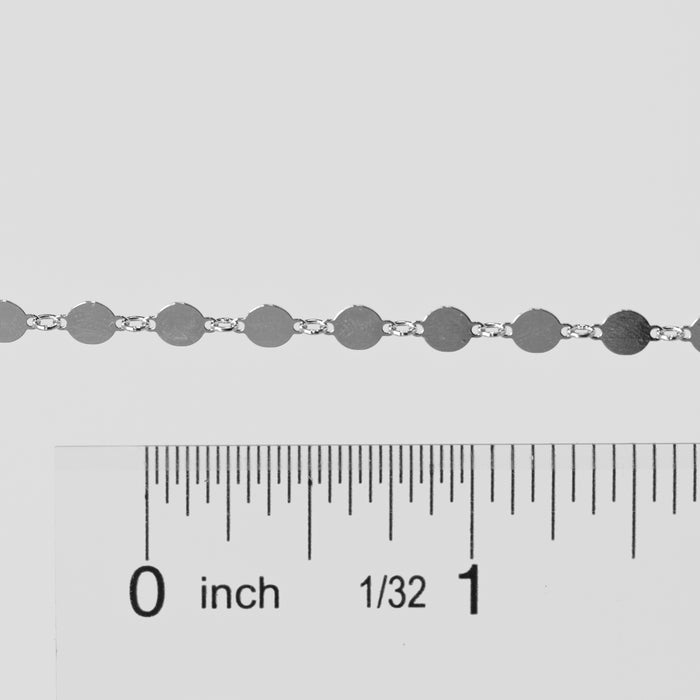 Silver chain with a ruler for measurement on a gray background