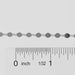 Silver chain with a ruler for measurement on a gray background