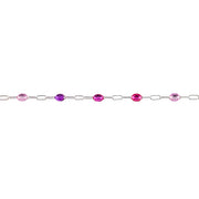 A silver permanent jewelry chain featuring alternating oval purple enamel, displayed horizontally against a solid white background.