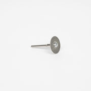 Pictured is a diamond disk on a little dremel attachment meant for sharpening permanent jewelry electrodes