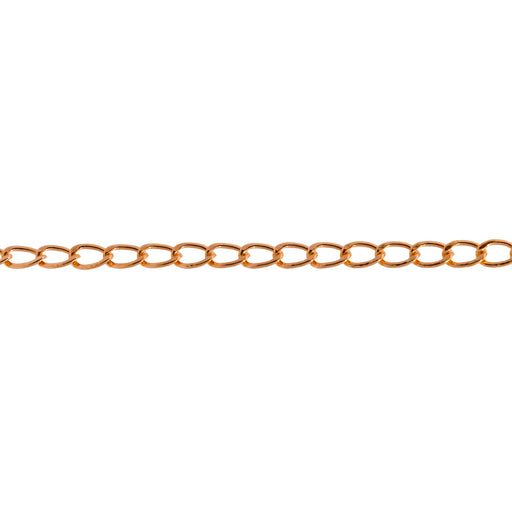 A close-up horizontal view of a gold filled yellow chain for permanent jewelry with flat curb links in a warm yellow-gold tone against a plain white background.
