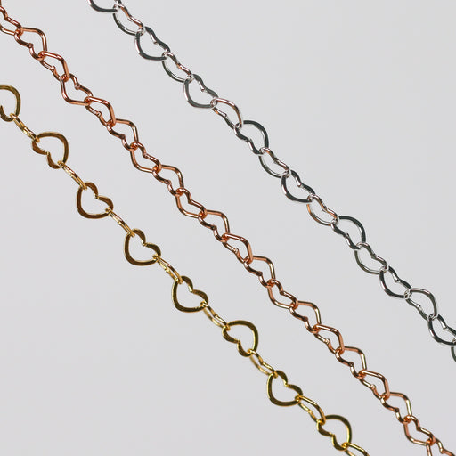 Three chains made from heart links in Yellow Gold, Rose Gold, and Sterling Silver