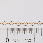 Sunstone certified heart shaped chain laying next to a ruler for measurements