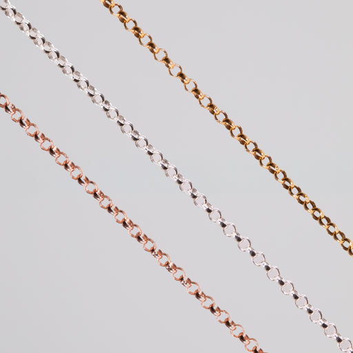 Three round linked permanent jewelry chains in different metal types and colors showcased on a light background.