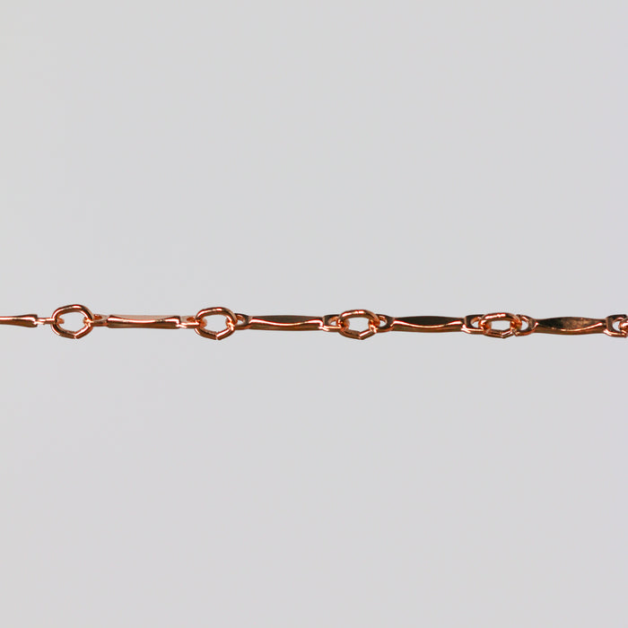 Rose gold dapped bar and link chain for permanent jewelry.