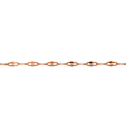 A close-up horizontal view of a yellow gold chain with repeating elongated diamond-shaped links that are a hammered paperclip design, set against a solid white background.