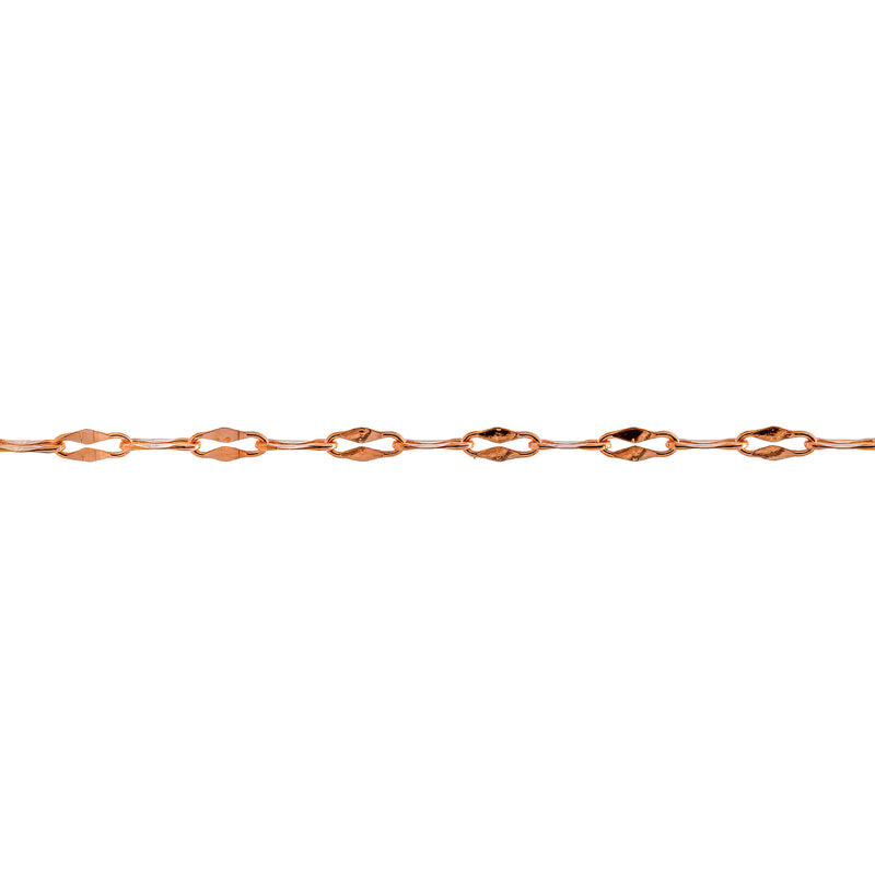 A close-up horizontal view of a yellow gold chain with repeating elongated diamond-shaped links that are a hammered paperclip design, set against a solid white background.