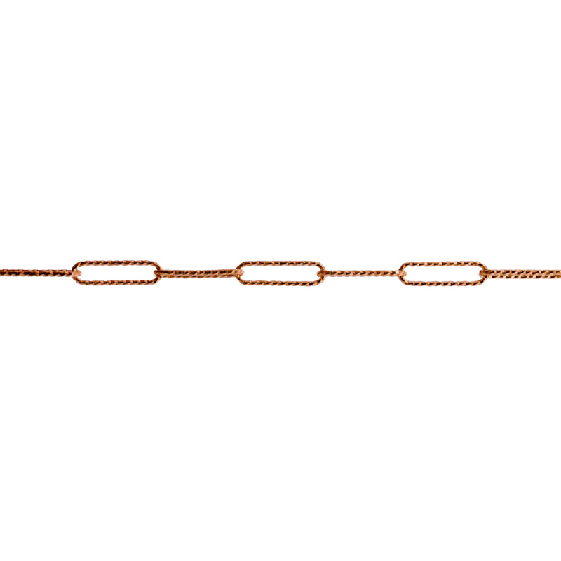 A close-up of a yellow gold chain link featuring elongated oval textured paperclip links in a warm gold tone, shown against a solid white background.