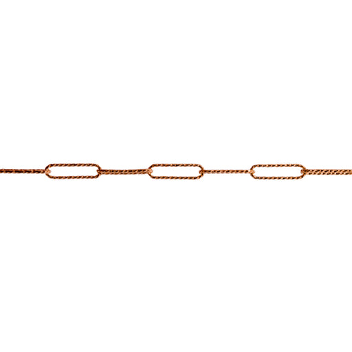 A close-up of a yellow gold chain link featuring elongated oval textured paperclip links in a warm gold tone, shown against a solid white background.